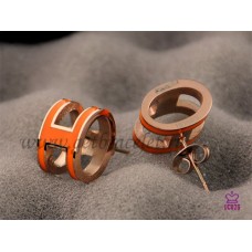 Hermes Pop H oranje oorbellen in Pinkw goud
