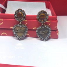 Dior LAmour Avenir-oorbellen met gele kristallen hart en vrouwelijke oude goudkleurige diamanten